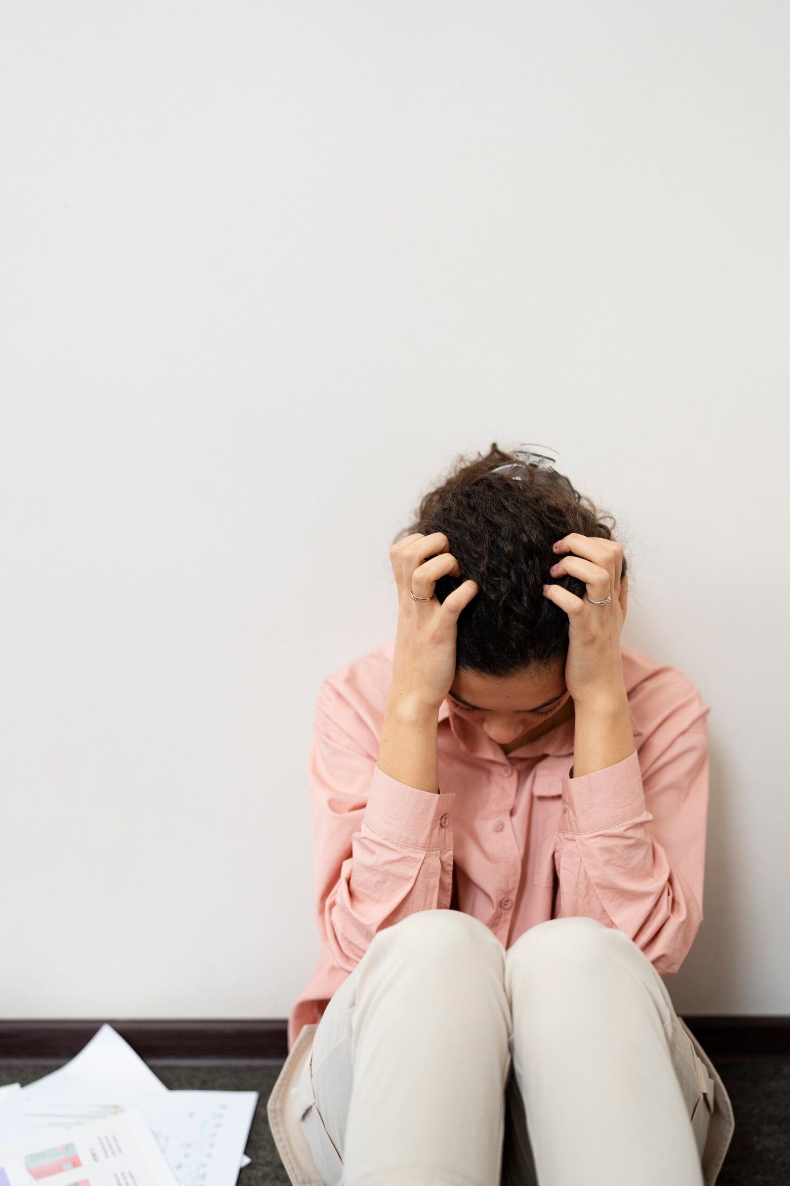 Person experiencing anxiety and emotional distress related to Obsessive Compulsive Disorder